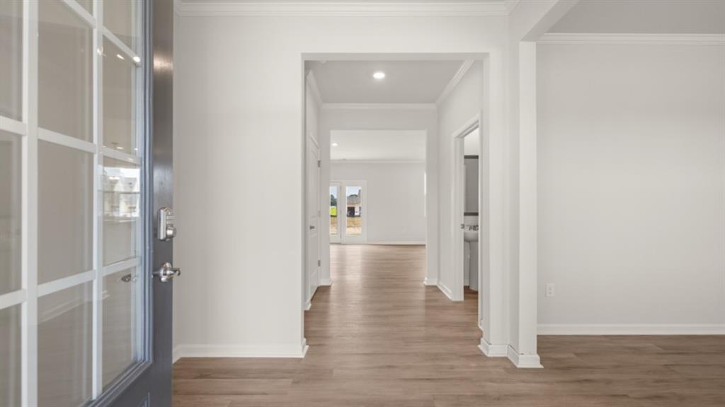 904 Sundown Point Villa Rica, GA 30180 - Photo 9 of 83 a view of a hallway with wooden floor