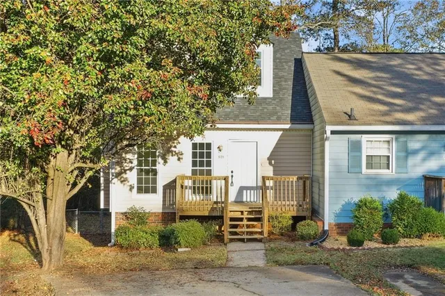front view of a house with a tree