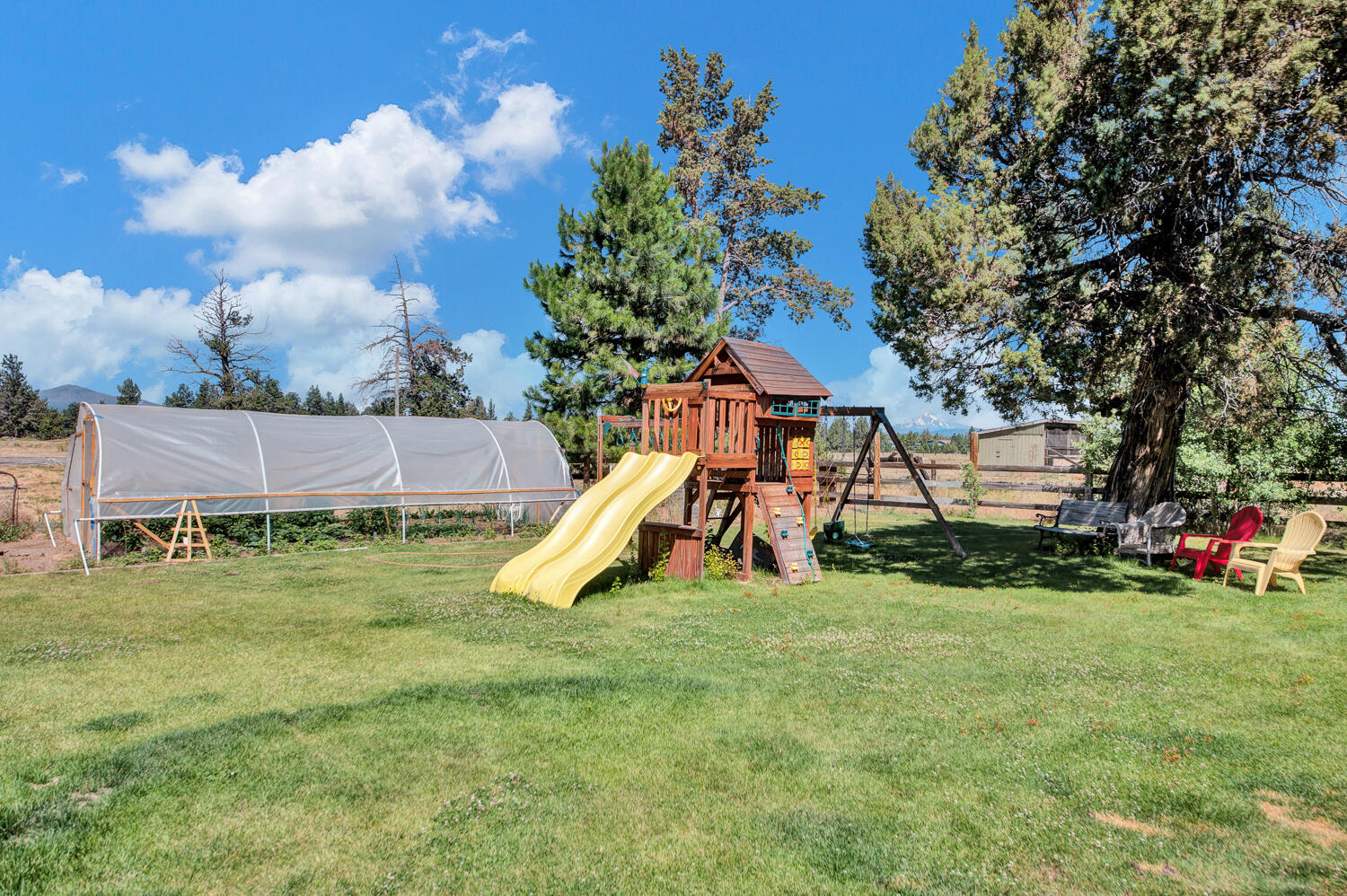 67100 Fryrear Road Bend, OR 97703 - Photo 18 of 38 a view of a house with a yard and a tree