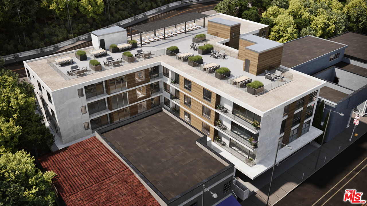 153 West Channel Road Santa Monica, CA 90402 - Photo 17 of 74 a view of a house with roof deck and furniture