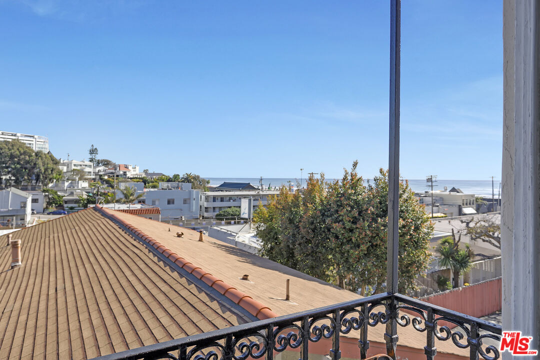 153 West Channel Road Santa Monica, CA 90402 - Photo 40 of 74 a view of a balcony with wooden floor and city view