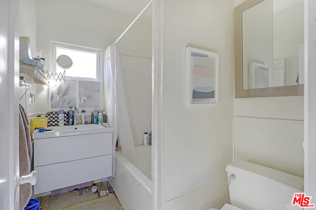 153 West Channel Road Santa Monica, CA 90402 - Photo 50 of 74 a bathroom with a sink toilet and shower