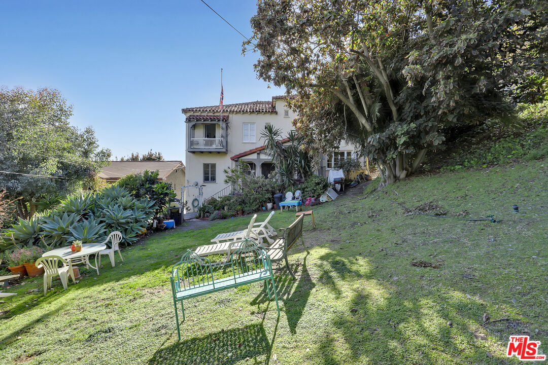153 West Channel Road Santa Monica, CA 90402 - Photo 55 of 74 a view of a chair and table in the garden