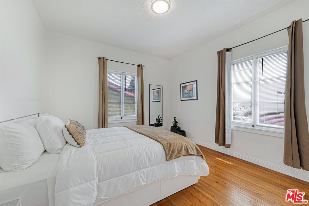 153 West Channel Road Santa Monica, CA 90402 - Photo 74 of 74 a bedroom with a bed and a window