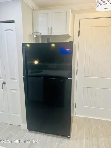 a view of a room with a bed