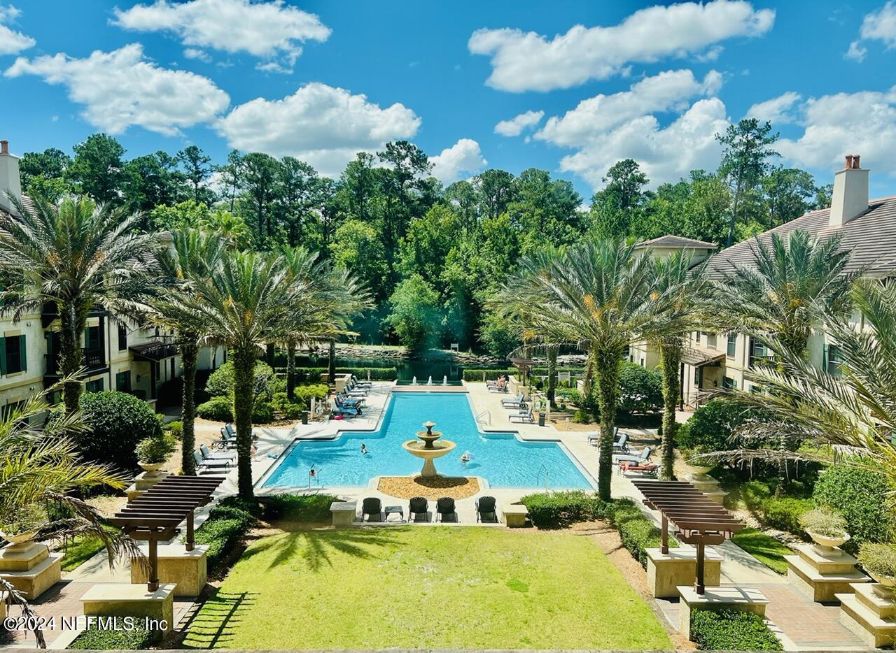955 Registry Boulevard, Unit 210 St. Augustine, FL 32092 - Photo 3 of 31 a view of a swimming pool with a yard