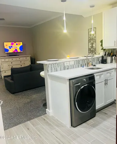 a living room with a couch and a flat screen tv