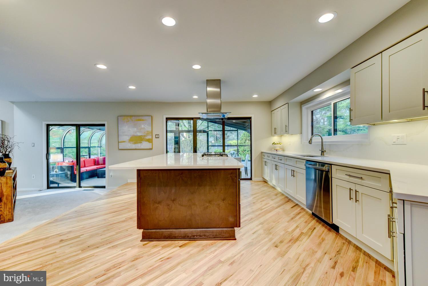 15 Hawk Drive Princeton Junction, NJ 08550 - Photo 30 of 95 a large kitchen with stainless steel appliances granite countertop a large counter top a stove and a wooden floors