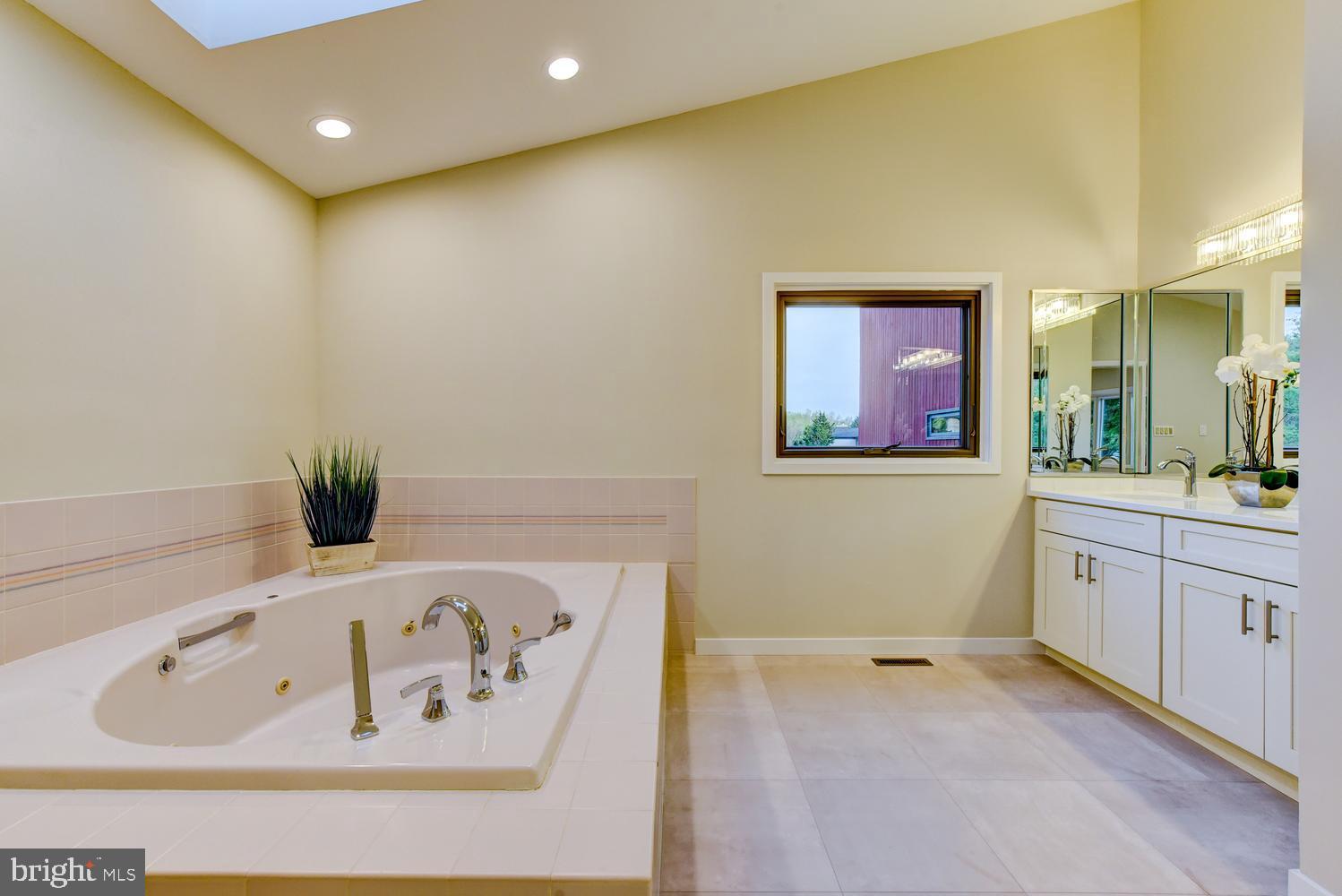 15 Hawk Drive Princeton Junction, NJ 08550 - Photo 50 of 95 a bathroom with a bathtub sink and mirror