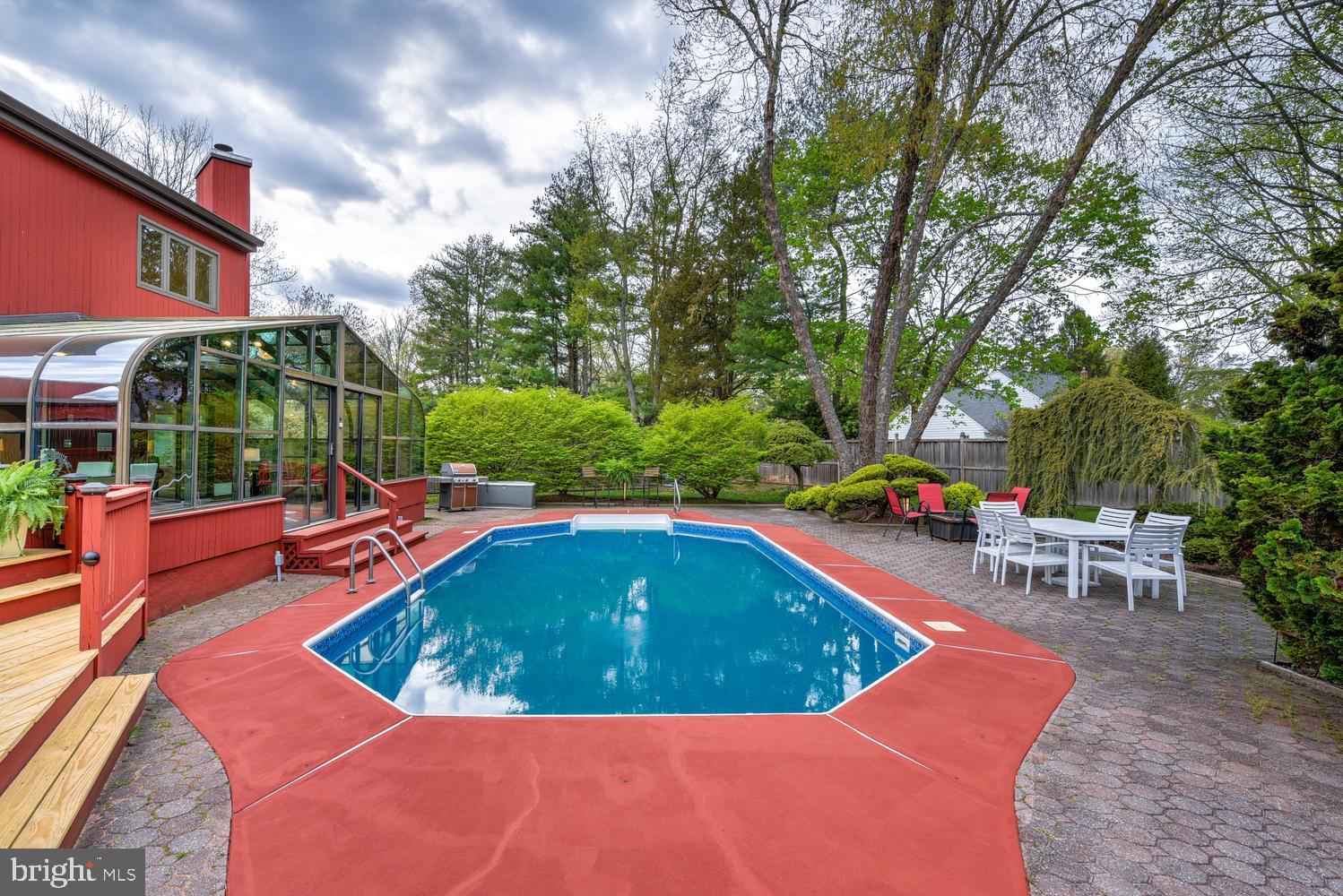 15 Hawk Drive Princeton Junction, NJ 08550 - Photo 72 of 95 a view of a swimming pool with lounge chairs