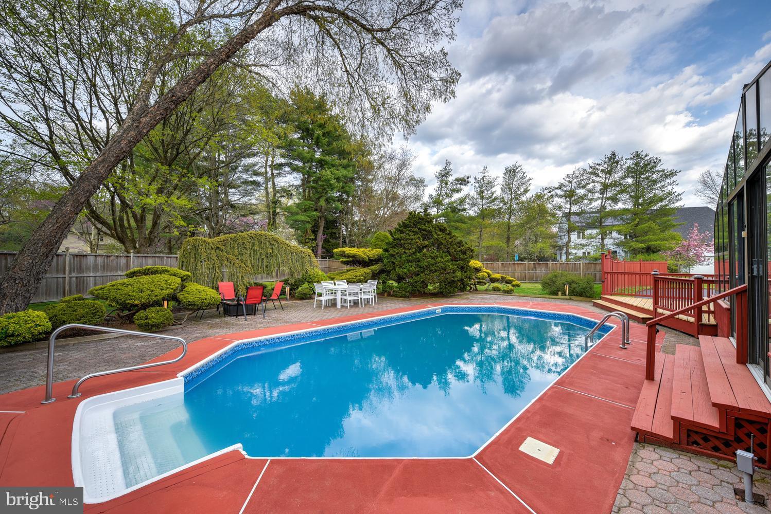 15 Hawk Drive Princeton Junction, NJ 08550 - Photo 76 of 95 a view of a swimming pool with a patio