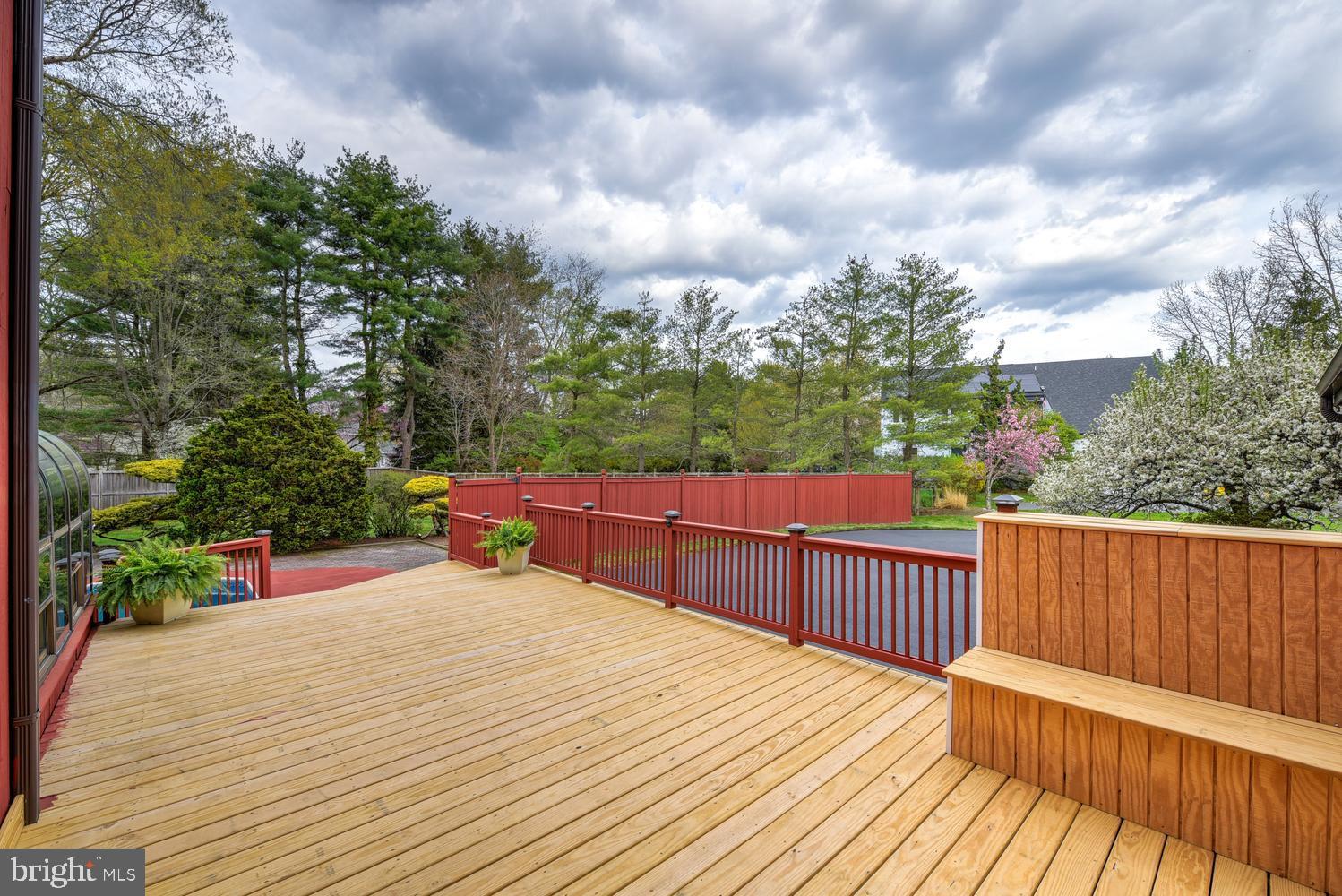 15 Hawk Drive Princeton Junction, NJ 08550 - Photo 80 of 95 a view of a deck with wooden floor and fence