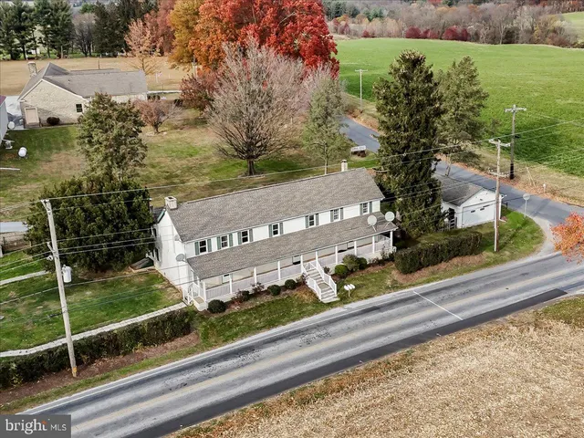 a view of a yard and front view of a house