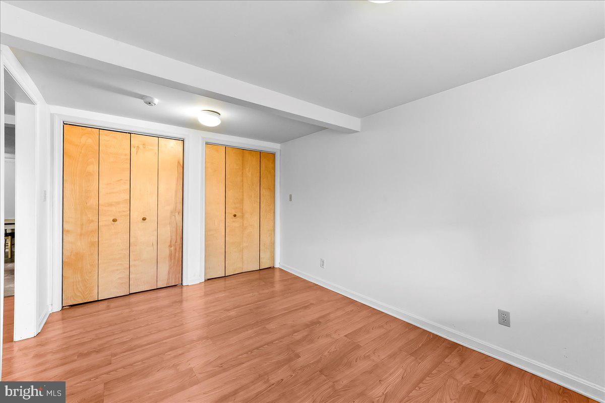 355 Gum Tree Road Coatesville, PA 19320 - Photo 13 of 24 a view of an empty room with wooden floor and a window