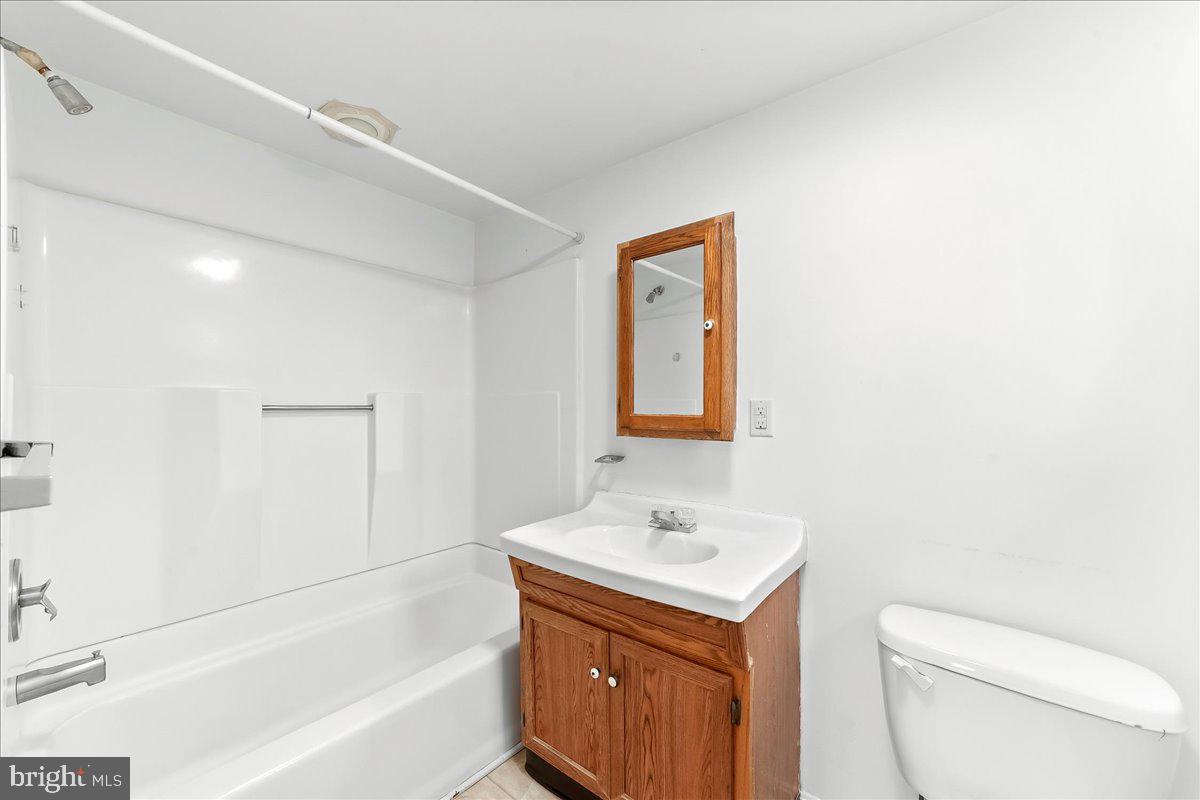 355 Gum Tree Road Coatesville, PA 19320 - Photo 14 of 24 a bathroom with a sink a toilet and shower