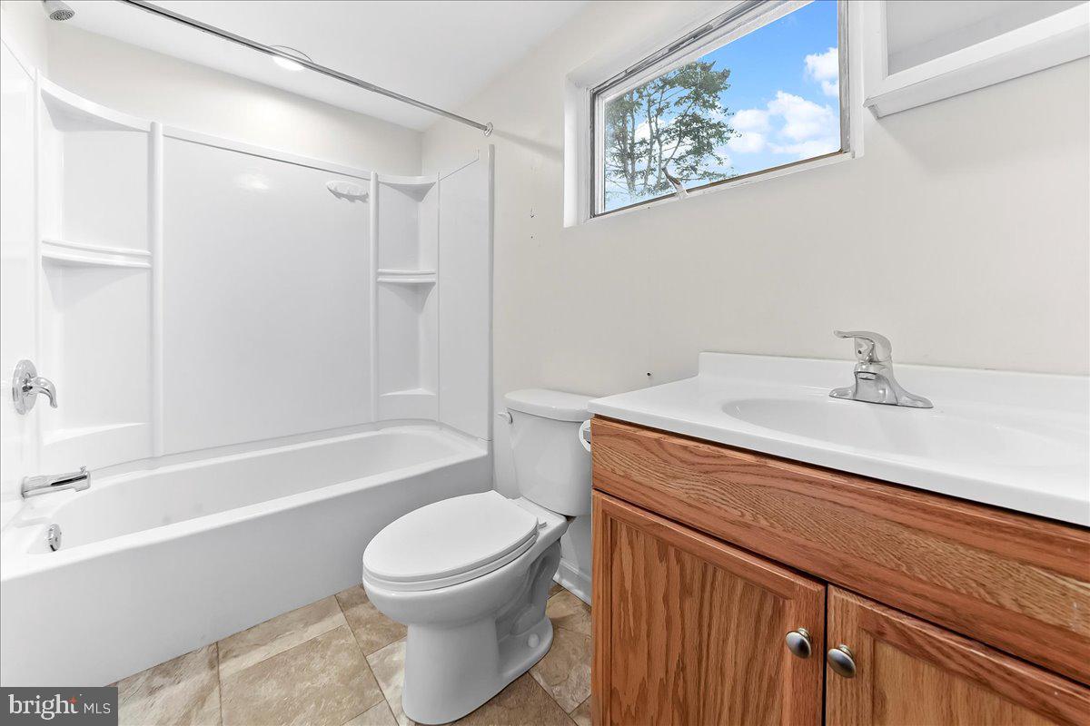 355 Gum Tree Road Coatesville, PA 19320 - Photo 15 of 24 a bathroom with a sink a toilet and shower