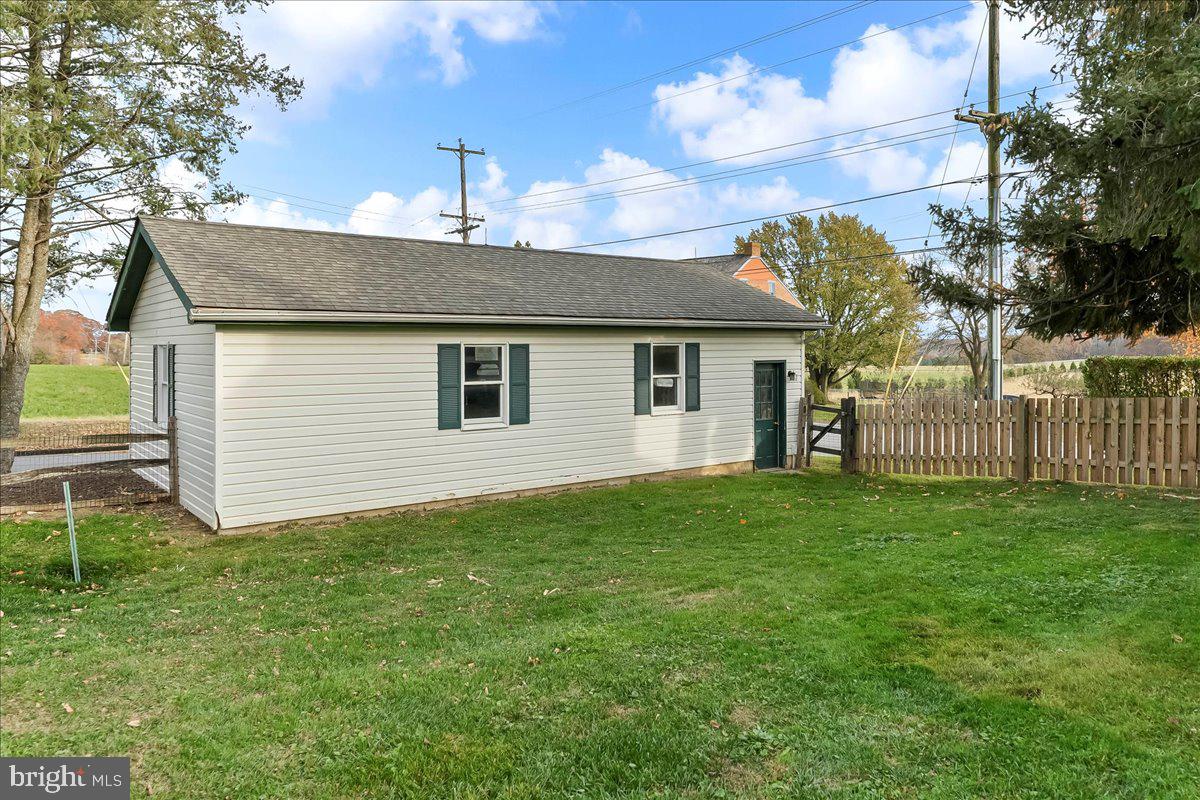 355 Gum Tree Road Coatesville, PA 19320 - Photo 18 of 24 a backyard of a house with lots of green space