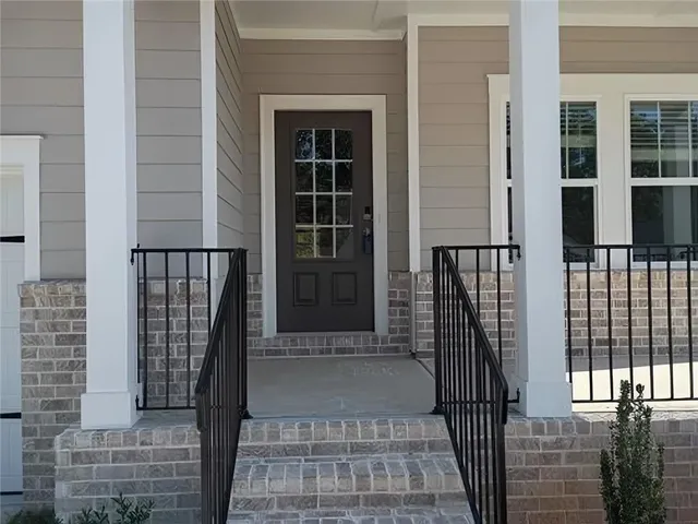 a view of a balcony with a potted plant