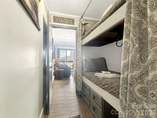 a en suite bathroom with a granite countertop sink and a mirror