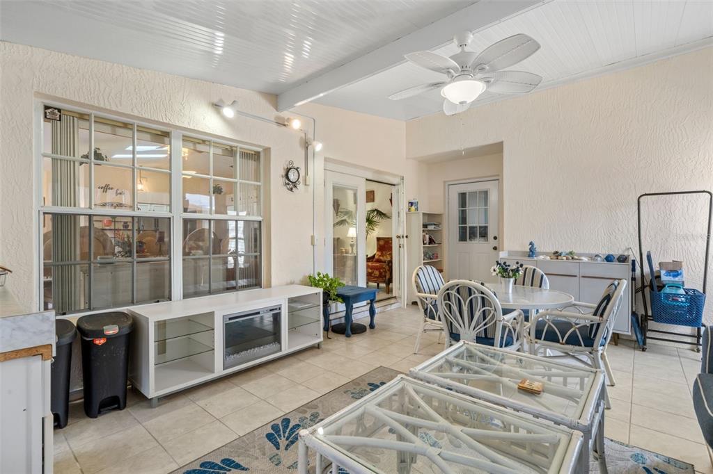 511 Marcia Loop Winter Haven, FL 33884 - Photo 18 of 46 a view of a dining room with furniture a chandelier and wooden floor