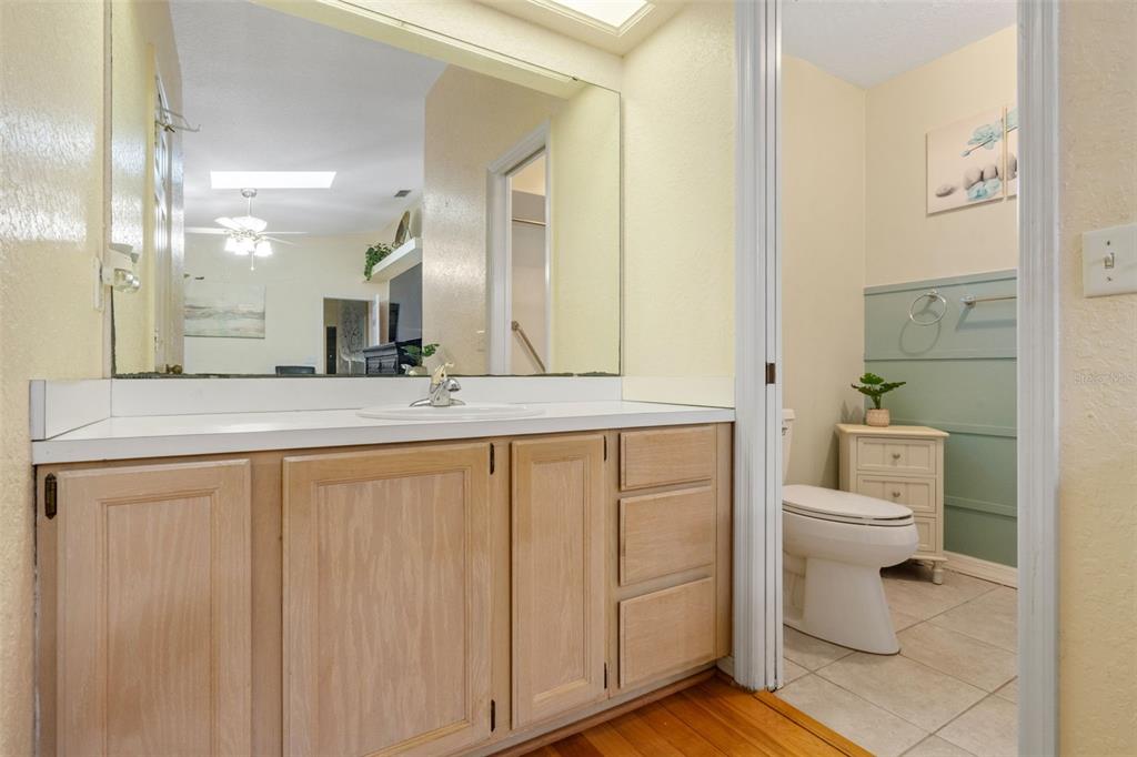511 Marcia Loop Winter Haven, FL 33884 - Photo 22 of 46 a bathroom with a granite countertop sink mirror and toilet