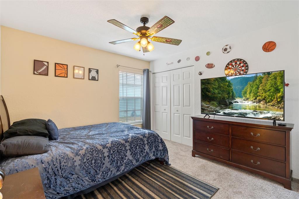 511 Marcia Loop Winter Haven, FL 33884 - Photo 26 of 46 a bedroom with a bed and a window