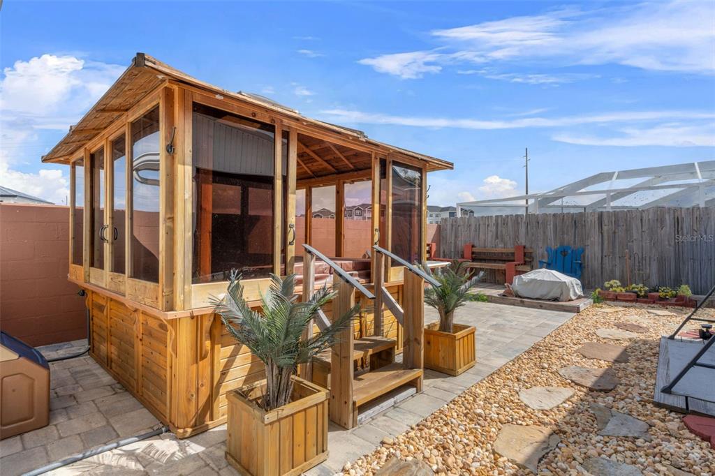 511 Marcia Loop Winter Haven, FL 33884 - Photo 33 of 46 a view of a patio with couches chairs and a wooden floor
