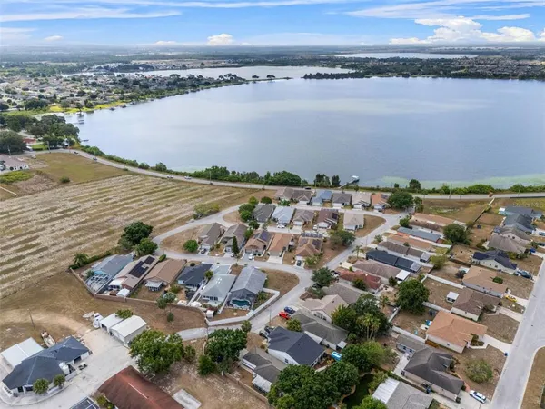 an aerial view of a city and lake view