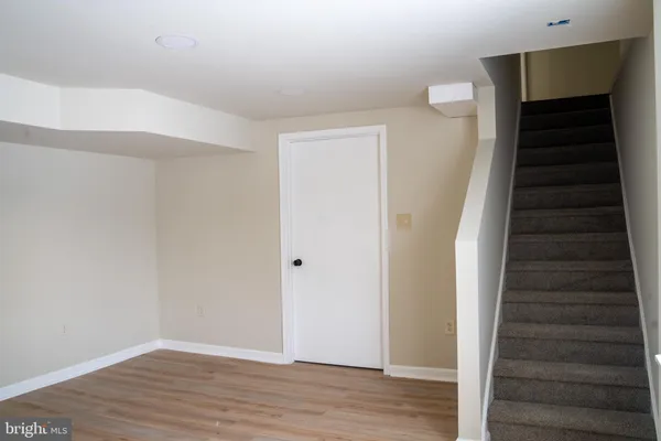 a view of an entryway with wooden floor