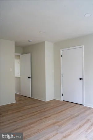 a view of room with wooden floor