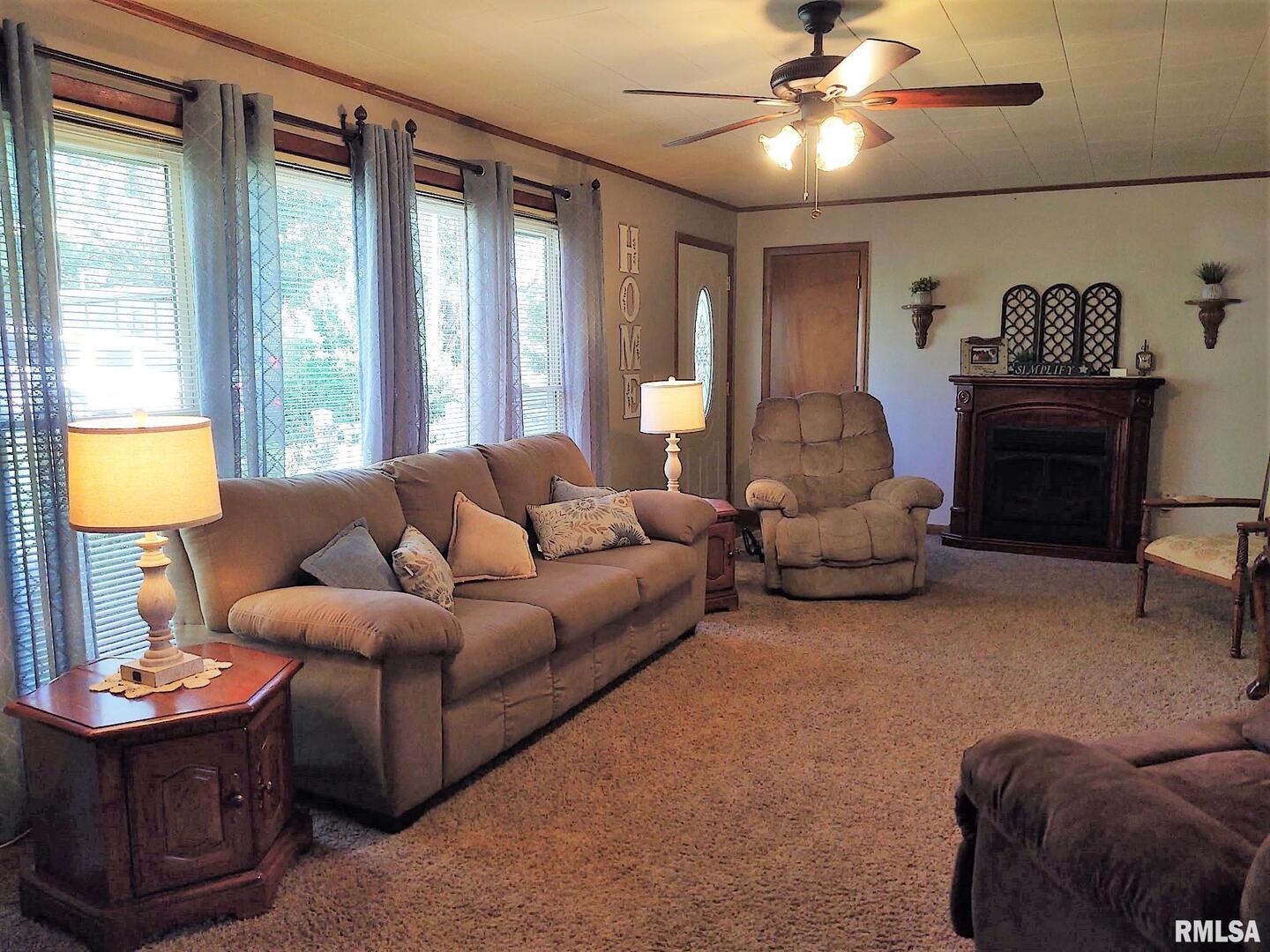 901 Locust Street Vienna, IL 62995 - Photo 19 of 25 a living room with furniture and a large window