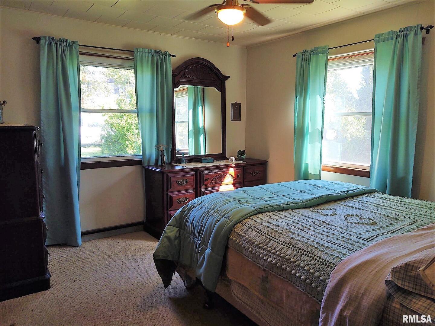 901 Locust Street Vienna, IL 62995 - Photo 20 of 25 a bedroom with a large bed and a large window