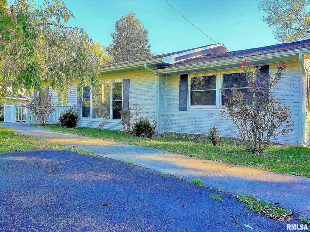 a view of house with backyard and outdoor space