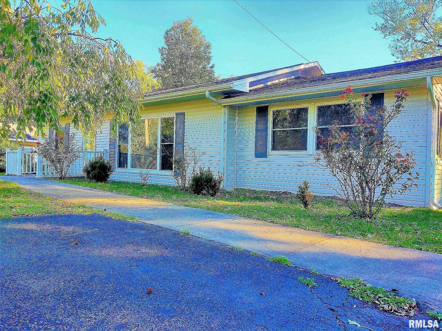 901 Locust Street Vienna, IL 62995 - Photo 2 of 25 a view of house with backyard and outdoor space