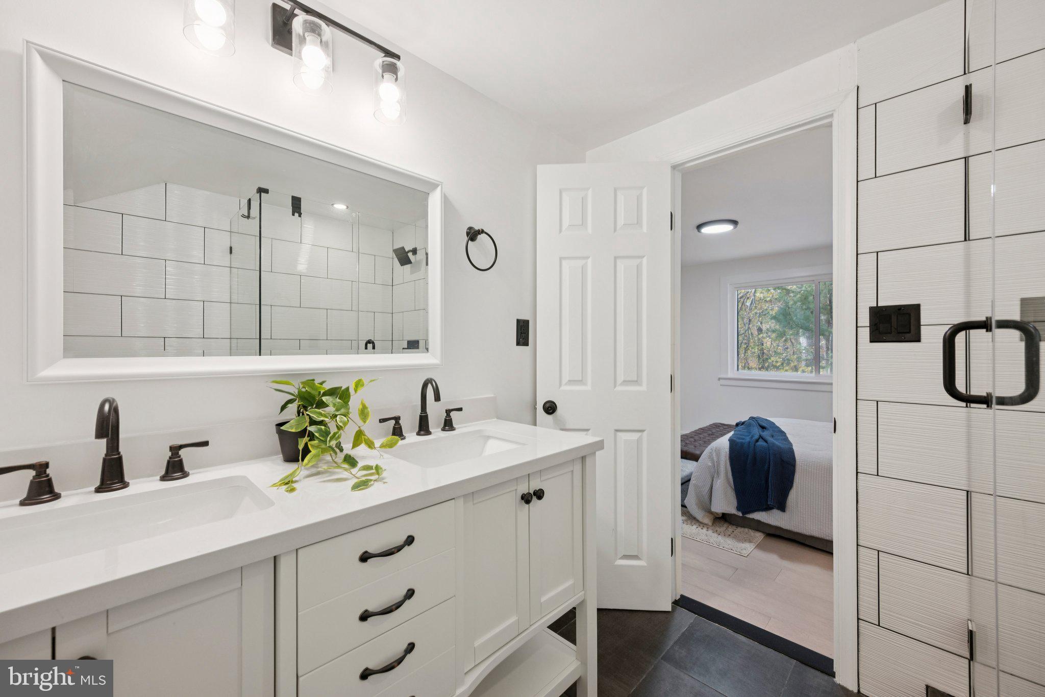 14912 Coles Chance Road North Potomac, MD 20878 - Photo 13 of 36 a bathroom with a sink and a mirror