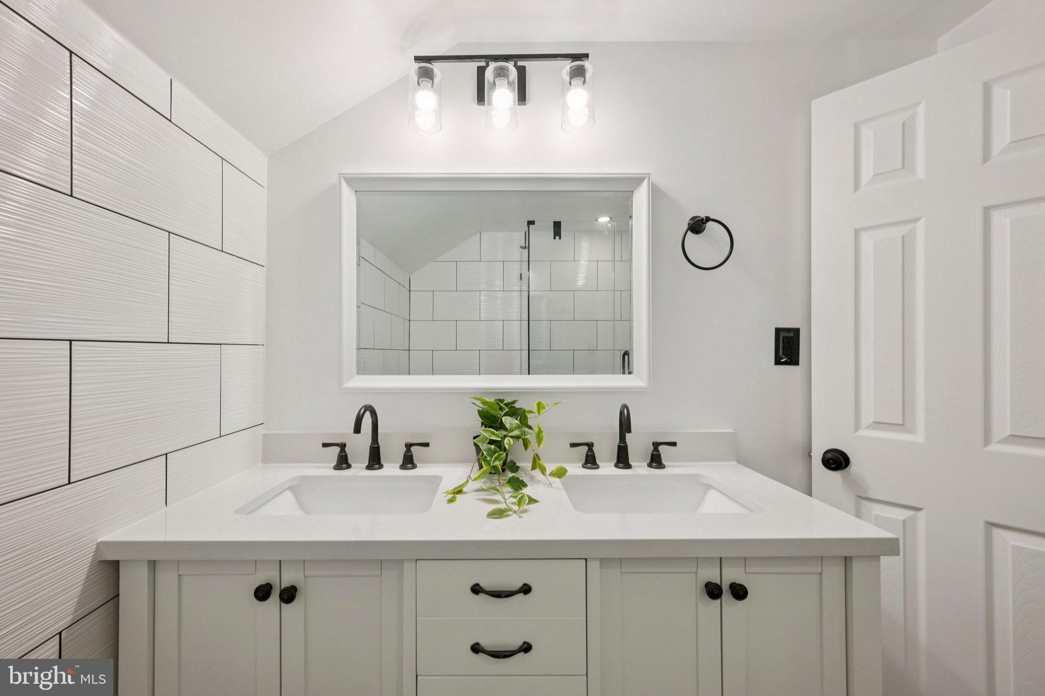 14912 Coles Chance Road North Potomac, MD 20878 - Photo 14 of 36 a bathroom with a sink and a mirror