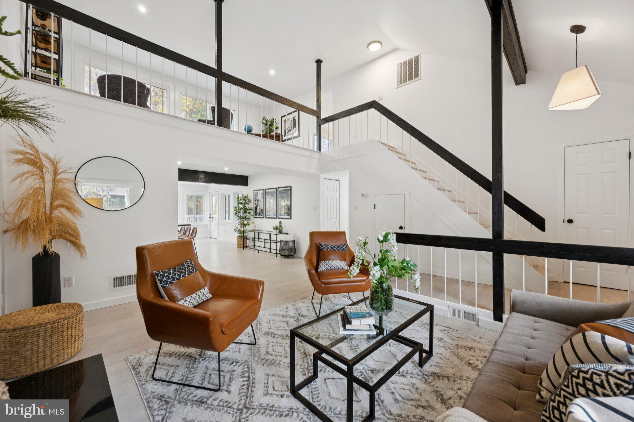 14912 Coles Chance Road North Potomac, MD 20878 - Photo 2 of 36 a living room with furniture and a wooden floor