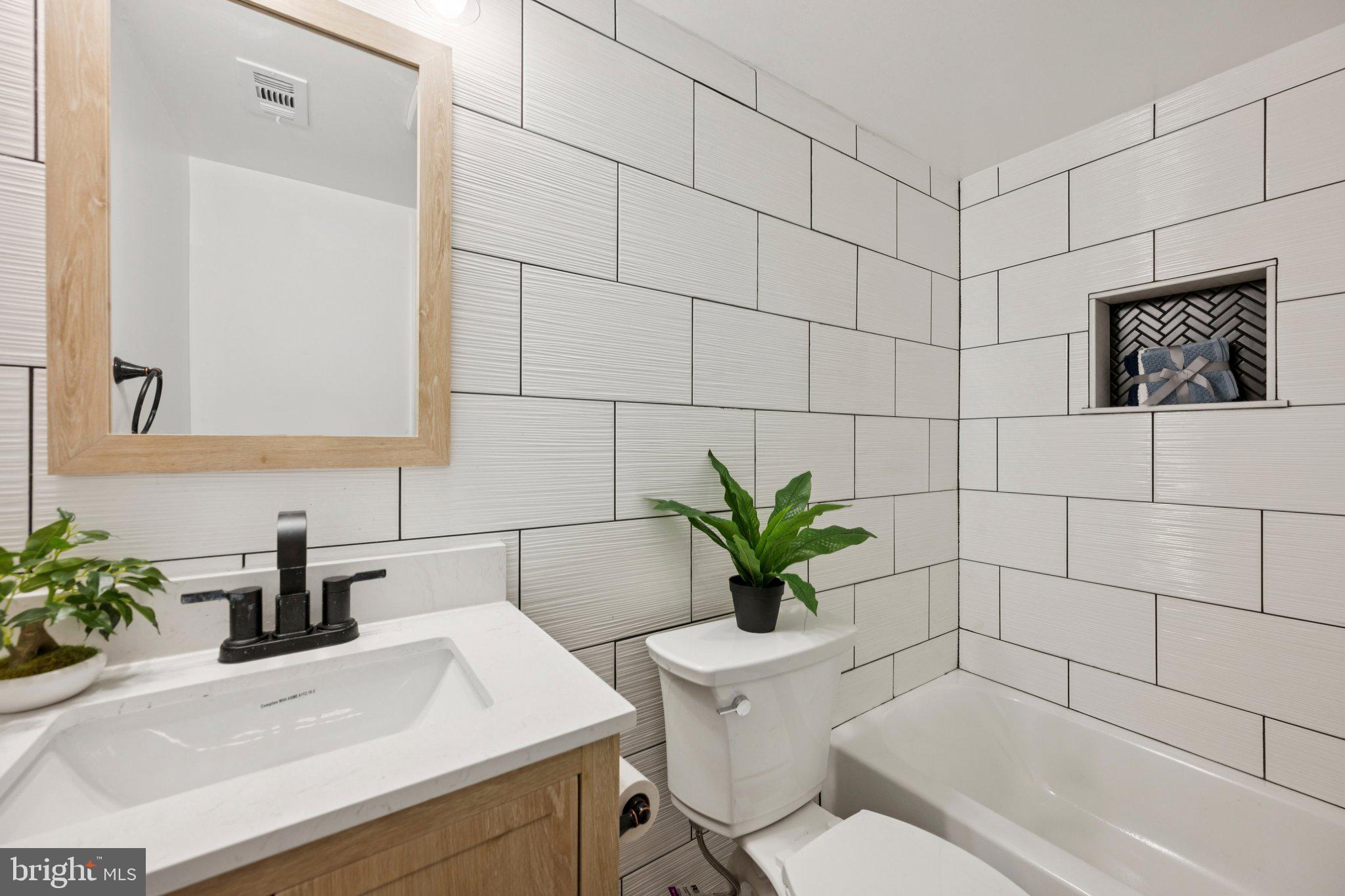 14912 Coles Chance Road North Potomac, MD 20878 - Photo 21 of 36 a bathroom with a sink toilet and shower