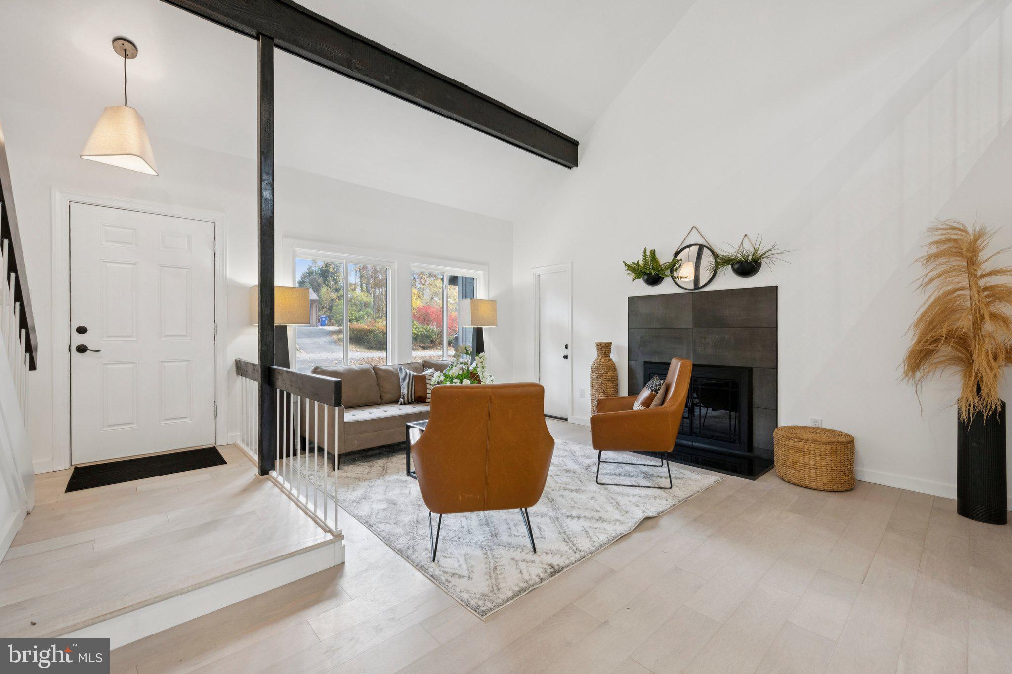 14912 Coles Chance Road North Potomac, MD 20878 - Photo 3 of 36 a living room with furniture and a fireplace