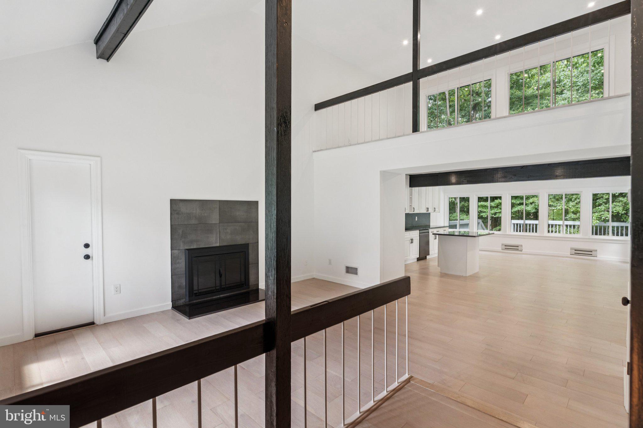 14912 Coles Chance Road North Potomac, MD 20878 - Photo 31 of 36 a view of a living room with furniture and a fireplace