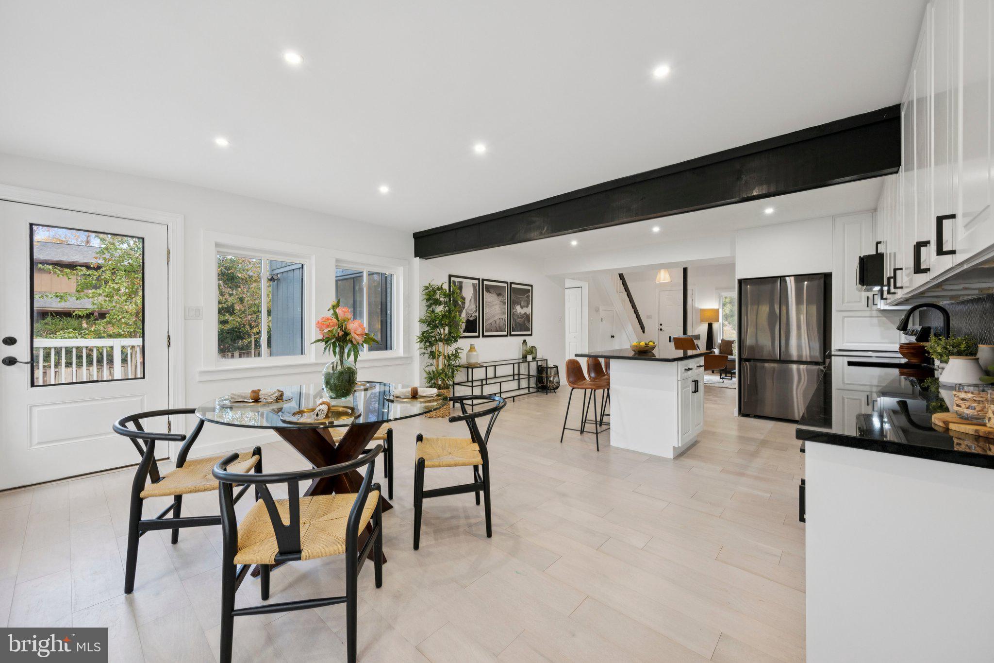 14912 Coles Chance Road North Potomac, MD 20878 - Photo 5 of 36 a view of a dining room with furniture and a kitchen