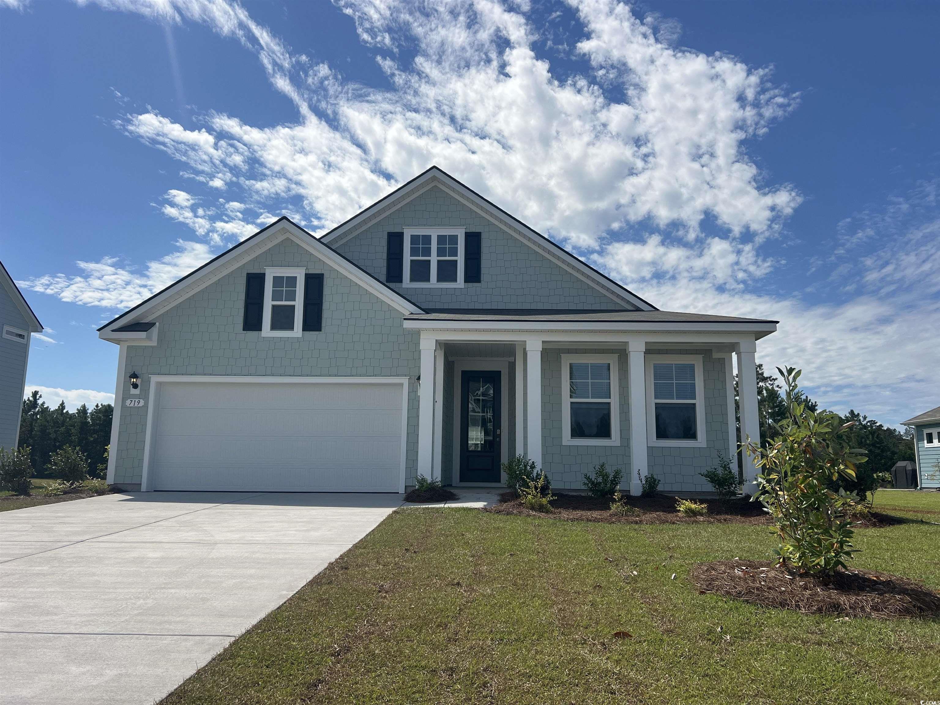 719 Rupert Drive Conway, SC 29526 - Photo 1 of 30 View of front of home featuring concrete driveway, a garage, a front lawn, and covered porch