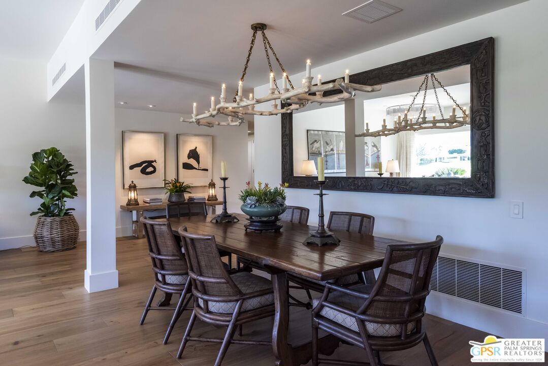 8 Surrey Court Rancho Mirage, CA 92270 - Photo 13 of 48 a view of a dining room with furniture window and wooden floor