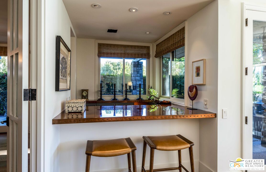 8 Surrey Court Rancho Mirage, CA 92270 - Photo 14 of 48 a dining room with furniture and a window