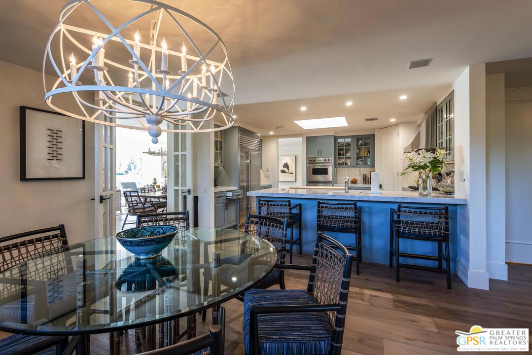 8 Surrey Court Rancho Mirage, CA 92270 - Photo 19 of 48 a view of a dining room with furniture and wooden floor