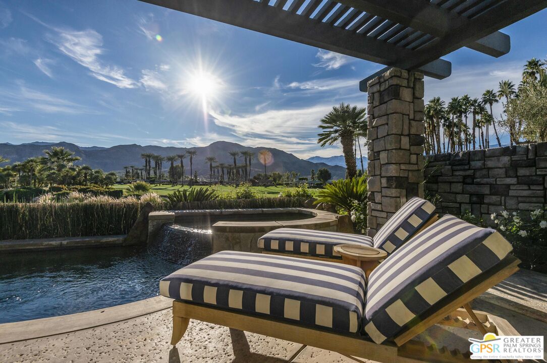 8 Surrey Court Rancho Mirage, CA 92270 - Photo 2 of 48 a balcony with outdoor seating and city view