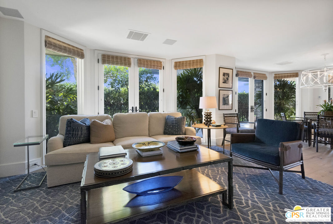 8 Surrey Court Rancho Mirage, CA 92270 - Photo 21 of 48 a living room with furniture and a large window