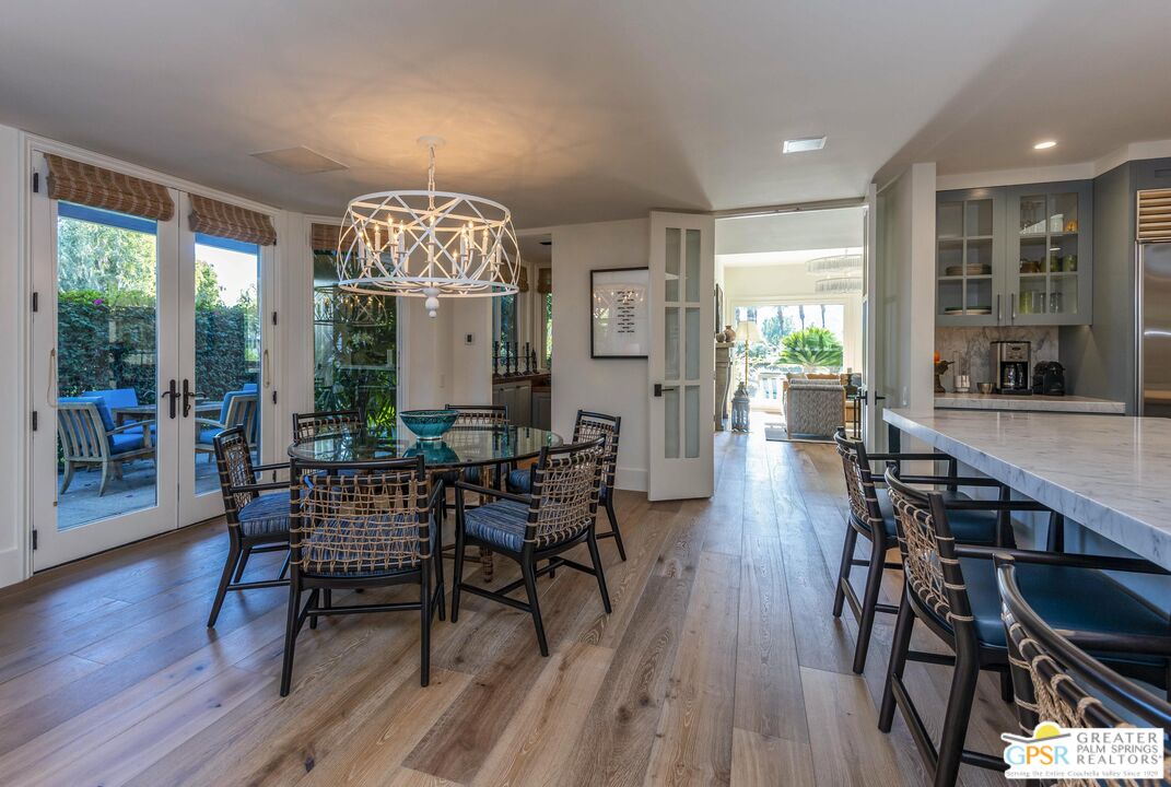 8 Surrey Court Rancho Mirage, CA 92270 - Photo 23 of 48 a dining room with furniture window and wooden floor