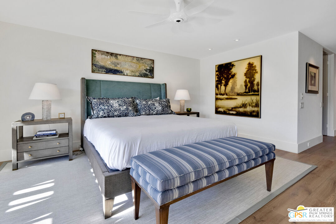 8 Surrey Court Rancho Mirage, CA 92270 - Photo 27 of 48 a bedroom with a bed and a night stand