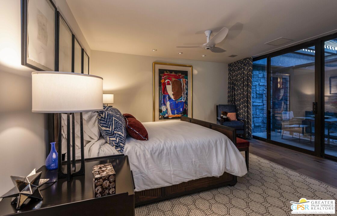 8 Surrey Court Rancho Mirage, CA 92270 - Photo 33 of 48 a bedroom with a bed and dresser with mirror